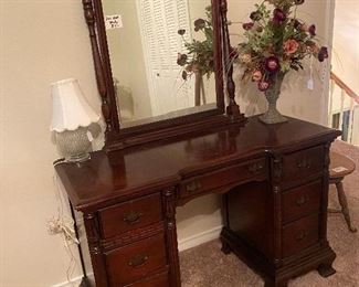 Dark wood antique vanity. There is a matching chest of drawers. 