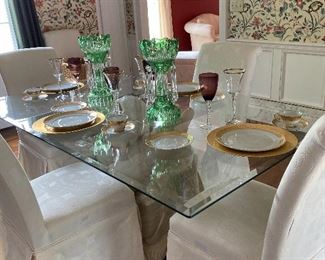 Classic glass topped dining room table with six parson’s chairs