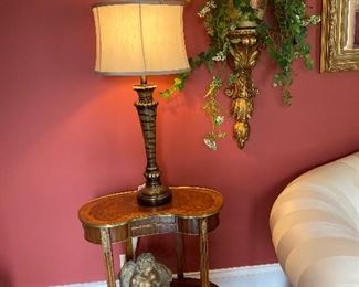 One of a pair of kidney shaped tables with fluted legs