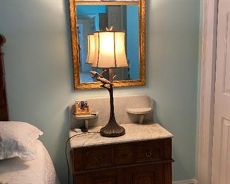 Marble topped Eastlake wash stand with lamp and painted mirror