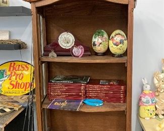 Versatile curio cabinet displaying Easter items and books. 