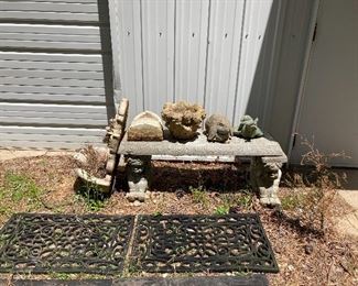 Concrete bench with fountain and garden items