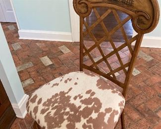 One of a pair of hide covered bar stools