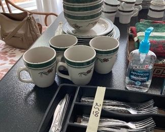 Place setting for four of brand new Cabela’s dishes.  Pine cone pattern