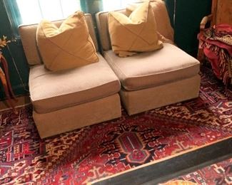A pair of Donghia slipper chairs with matching Donghia pillows