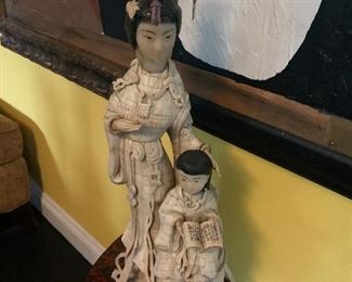 A large bone sculpture of an Asian mother and child. This piece was purchased in Hong Kong over 50 years ago. It is bone not ivory so can be sold to anyone.