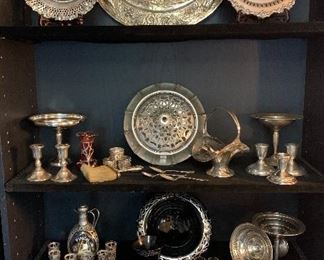 Silver collection 
The middle two shelves are all sterling 
The lower shelf is all coin silver