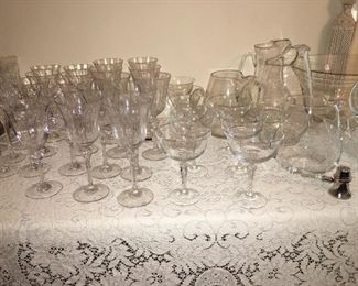tables of unused vintage fine crystal stemware