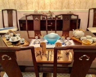 Formal Dining table& chairs,Asian tea sets, trays, etc. matching sideboard in back 