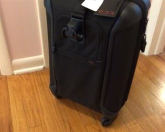 Tumi high end roll on suitcase