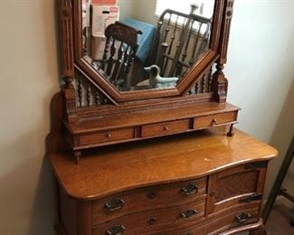 #1	Antique Dresser w/Mirror & 6 drawers & 1 door w/Carved Ball & Claw Foot on Wheels   48x20x33  Beveled  Mirror  46x 9Dx45   (as is finish - Top)	 $499.00 
