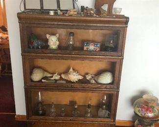 Stacking bookcase, banks, oil lamps, antique lamp