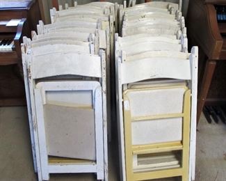 Large collection of white event chairs