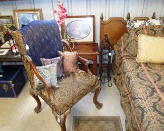 Mid-century king headboard, elegant armchair with rich tapestry-like upholstery