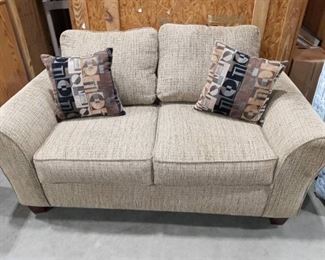 American Furniture Company Tan Loveseat with 2 Accent Pillows Approximately 25 x 63 x 36 in