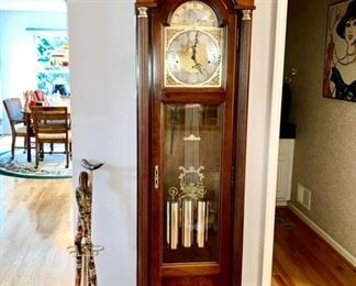 Howard Miller Grandfather clock, cane stand w/ 3 collectible canes