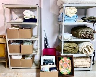 Boxes of towels, bedding, linens, many frames, vintage wall clock