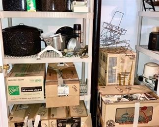 Canning roasters, many boxes of canning jars, additional canning accessories, pressure cooker in box