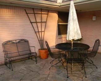 Swinging Rod-Iron Patio Bench (45.5”x30”24”).                     Rod-Iron Patio Table (48”x 30”) with 4 Swinging Chairs     