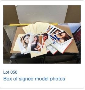 box of signed model photos
