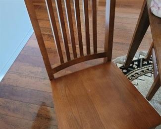 Wood dining table set chair detail