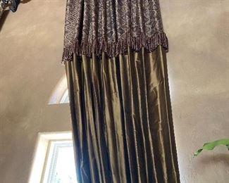 $400. Set of window treatments. Drapes. Shimmery olive green. About 20 feet long. 