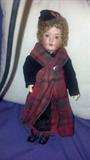 an Armand Marseille 39-, German from the 1920 era. original Scottish outfit.