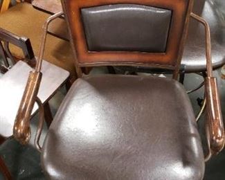(2) Upscale Wrought Iron Swivel Brown Vinyl With Wood Bar Armchairs (1 chair has a ripped seat in front) $275