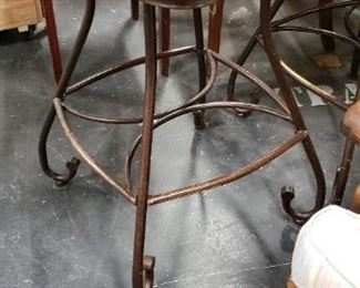 (2) Upscale Wrought Iron Swivel Brown Vinyl With Wood Bar Armchairs (1 chair has a ripped seat in front) $275