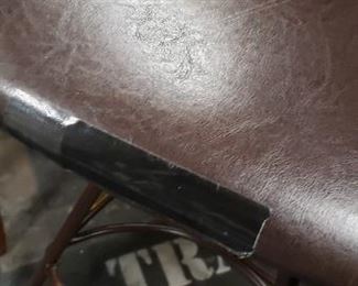 (2) Upscale Wrought Iron Swivel Brown Vinyl With Wood Bar Armchairs (1 chair has a ripped seat in front) $275