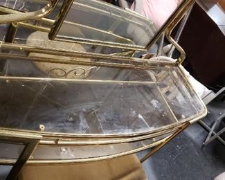 Vintage Brass & Glass Vanity Table With Mirror & Bench    Measures 39 and 3/4 inches long by 15" deep the table itself is 31 and a 1/2 inches tall the mirror from floor to tip is almost 66" tall.  (2 available) $250 ea for choice