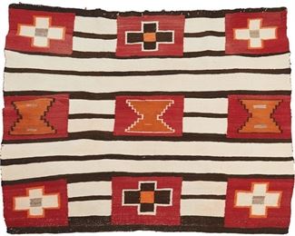 96
A Navajo Transitional Second Phase Chief-Style Weaving
Late 19th/ early 20th Century
Woven in alternating cream and dark brown bands with a nine block design in three rows featuring crosses and hourglasses in orange and red
50" L x 53" W
Estimate: $4,000 - $6,000