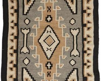 101
A Navajo Two Greys Hills Weaving
Mid-20th Century
Woven of grey, black, and cream wool with a central diamond with a meandering border with corner extensions and a black exterior border
56.5" L x 38" W
Estimate: $700 - $900