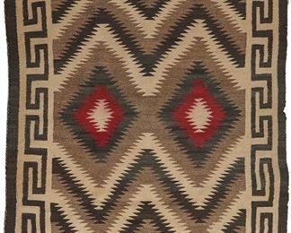 104
A Navajo Regional Rug
Second-quarter 20th Century
Woven of red, cream, tan, and dark brown with double serrated diamonds and keyed border
70" L x 47" W
Estimate: $400 - $600