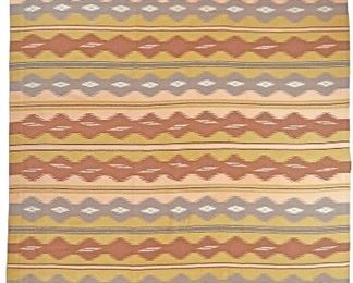 98
A Contemporary Navajo Room-Sized Rug
Late 1980s/early 1990s
The custom hand-woven polychrome wool rug with alternating bands of serrated diamonds
167" L x 120" W approximately
Estimate: $2,000 - $3,000