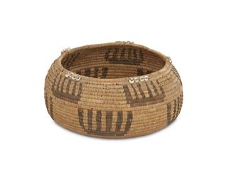 118
A Pomo Gift Basket
First-quarter 20th Century
Woven with staggered geometric motif throughout, rim with stitched clam shell decoration
2.5" H x 5" Dia.
Estimate: $400 - $600