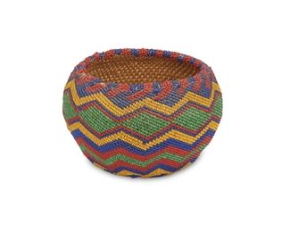 119
A Pomo Beaded Basket
First-half 20th Century
With an allover polychrome beaded geometric design
2.875" H x 4.25" Dia.
Estimate: $400 - $600