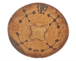 125
A Large California Mission Storage Basket
First-quarter 20th Century
With four floating cross elements in dark brown, additional elements in polychrome
8.5" H x 24" Dia.
Estimate: $1,000 - $2,000