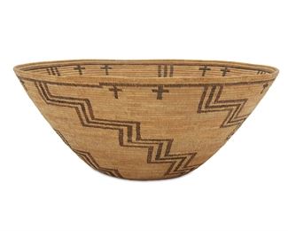 131
A Tulare Polychrome Storage Basket
Circa 1915
With five radiating stepped arms issuing from rim band with attached cross motif
8" H x 19.25" Dia.
Estimate: $1,500 - $2,000