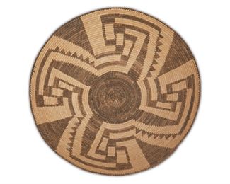 134
A Miniature Tohono O'odham (Pima) Basketry Tray
First-quarter 20th Century
Finely woven in four concentric fretwork bands
1.5" H x 7.25" Dia.
Estimate: $1,000 - $1,500