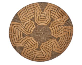 134
A Miniature Tohono O'odham (Pima) Basketry Tray
First-quarter 20th Century
Finely woven in four concentric fretwork bands
1.5" H x 7.25" Dia.
Estimate: $1,000 - $1,500