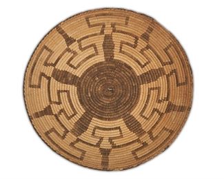 137
A Tohono O'odham (Pima) Basketry Gambling Tray
First-quarter 20th Century
Woven with a five-pointed central star and meandering border
3" H x 15" Dia.
Estimate: $500 - $700
