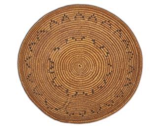 139
A Navajo Wedding Basket
First-half 20th Century
Woven with polychrome zigzag band
3.25" H x 13.5" Dia.
Estimate: $200 - $300