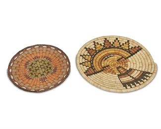 142
Two Hopi Basketry Trays
Mid-20th Century
The first with a coiled construction depicting Poly Mana Kachina, the second with a turtle motif and accompanied prize ribbon
Largest: 13.25" Dia.
Estimate: $250 - $350