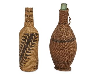 144
Two Native American Basketry Bottles
Late 19th/early 20th Century
One with tag: Klamath Falls basket/ Bought by Frederick S. Thompson /1898
The first a Klamath Falls woven basket over a glass bottle form with a handle and foot; the second a Pitt River twined basket with caterpillar motif, 2 pieces
Each: 12" H
Estimate: $400 - $600