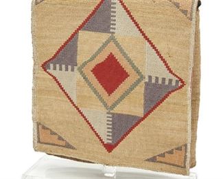 147
A Nez Perce Twined Cornhusk Bag
First-quarter 20th Century
The twined cornhusk double-sided flap-top bag with polychrome geometric motifs lined with red trade cloth displayed on a custom acrylic stand
11" H x 9.5" W
Estimate: $600 - $800