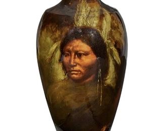 150
A Weller Louwelsa Art Pottery Vase With Native American Portrait
First-quarter 20th Century
Signed: M. Rauchfuss / W / 565 / 1
The high glaze Louwelsa vase with an urn-form body and tapered neck decorated with a Native American portrait against a dark red ground
11" H x 7" Dia.
Estimate: $500 - $700