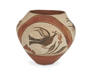 153
A Zia Polychrome Pottery Olla
Second-quarter 20th Century
Marked to underside: Zia Pueblo N.M.
Four avian panels depicting two different types of birds with a rainbow ribbon, with a red interior and high gloss finish to lower exterior
9" H x 10.5" Dia.
Estimate: $600 - $800
