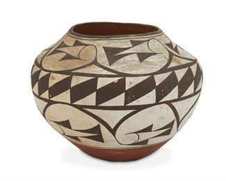 156
An Acoma Polychrome Pottery Olla
First-quarter 20th Century
Slip glaze with geometric band to shoulder, swirls to upper and lower portions done in dark brown on white, with partial red interior and lower exterior
8.25" H x 10" Dia.
Estimate: $800 - $1,200