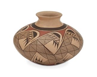161
A Clinton Polacca Nampeyo Pottery Vase
(b. 1958, Hopi)
Signed to underside: Clinton Polacca "Nampeyo"
A polychrome vessel with an avian motif
5.5" H x 7.5" Dia.
Estimate: $200 - $300